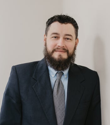 Portrait of Justin Myers, Realtor.